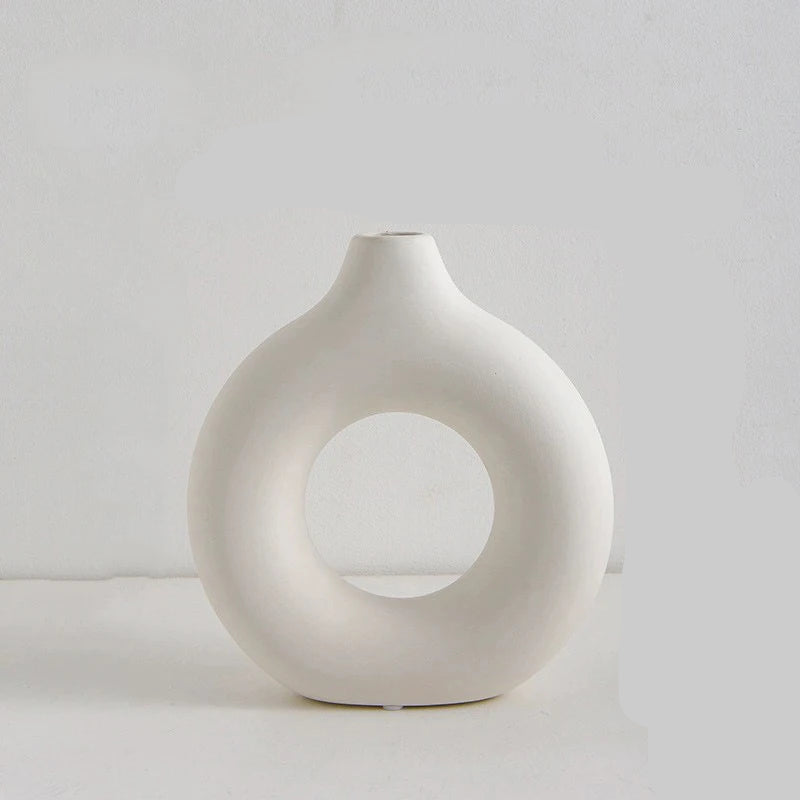 White vase with dimensions labeled on a light gray background