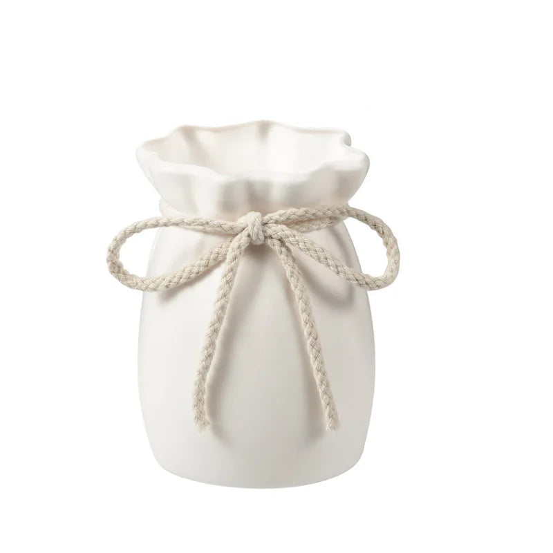 White drawstring bag with measurements on a white background