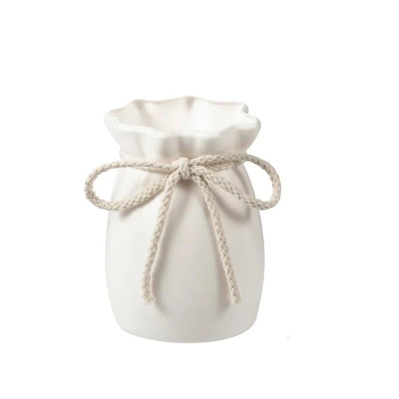 White drawstring bag with measurements on a white background