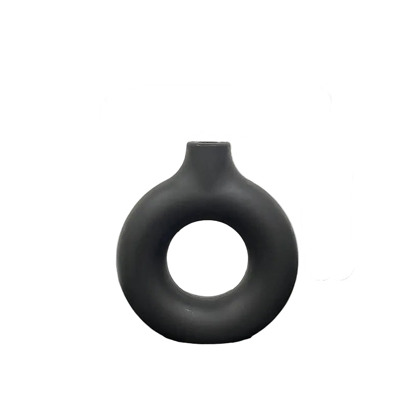 Gray vase with measurements on a reflective surface