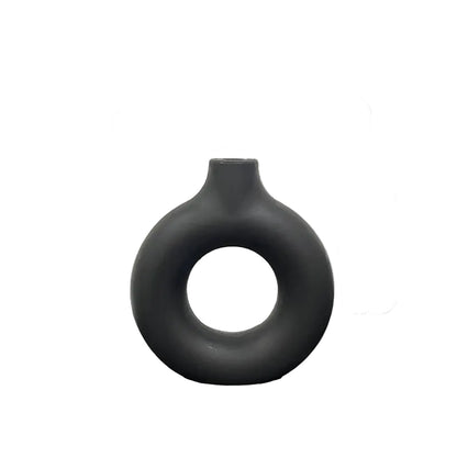 Gray vase with measurements on a reflective surface