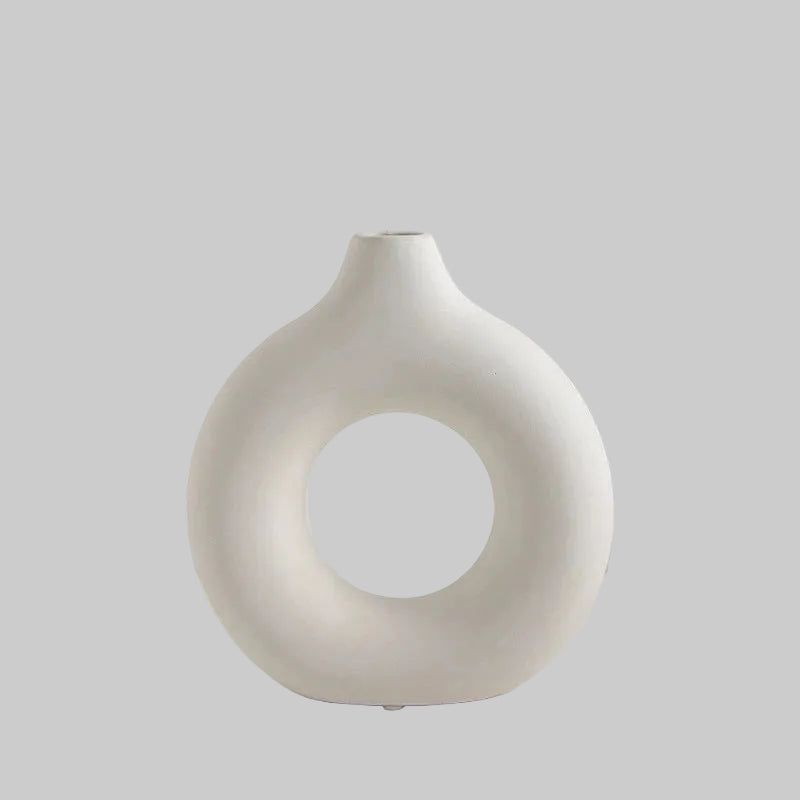 White vase with dimensions labeled on a light gray background