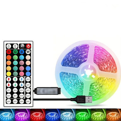 RGB LED strip with remote control and USB cable on a white background